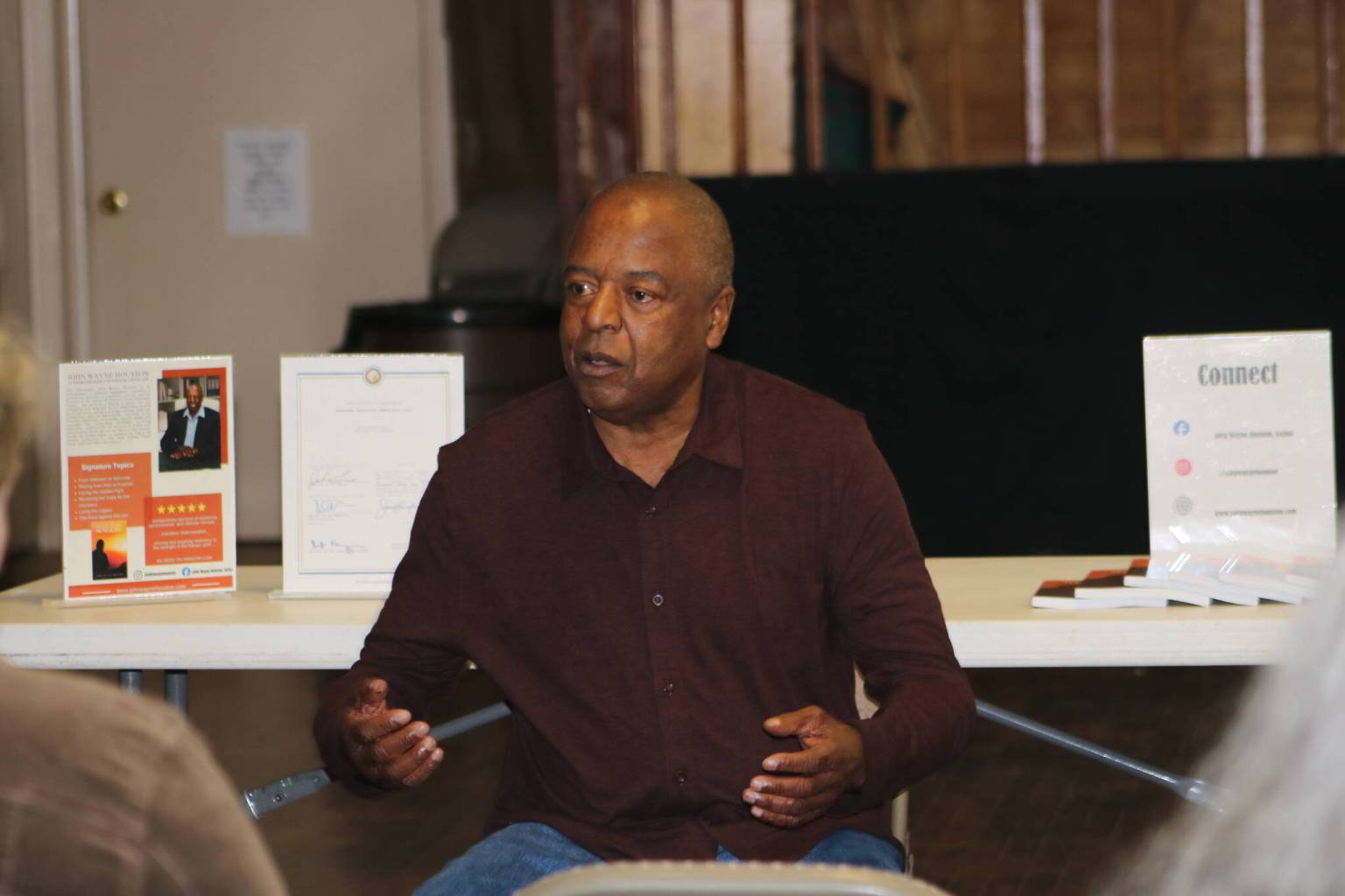 John Houston speaking at a public event about Return to the Sunlight.